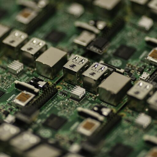Detailed shot of a Raspberry Pi circuit board showcasing its components, USB ports, and microchips.